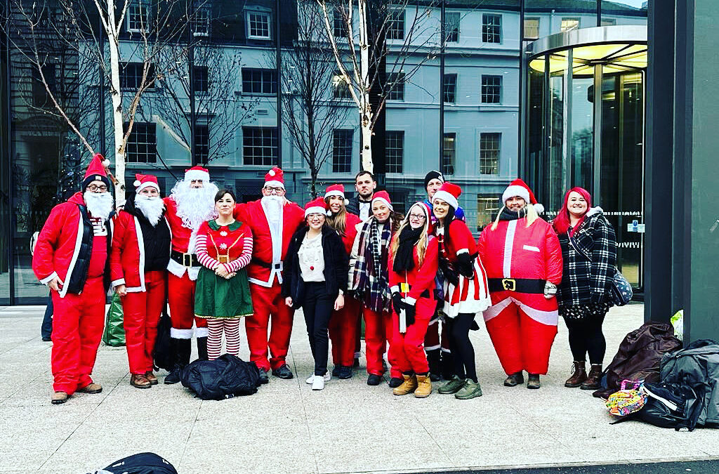 15 Father Christmases turn up at the Molly Ollys office, having walked 19 miles from Birmingham to Warwick!