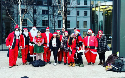 15 Father Christmases turn up at the Molly Ollys office, having walked 19 miles from Birmingham to Warwick!