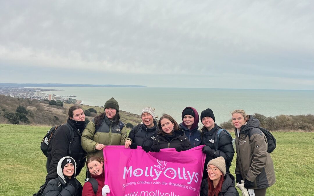 Young group of fundraisers help their friend give back to charity that supported her